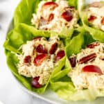 Curry chicken salad lettuce wraps on a white plate.